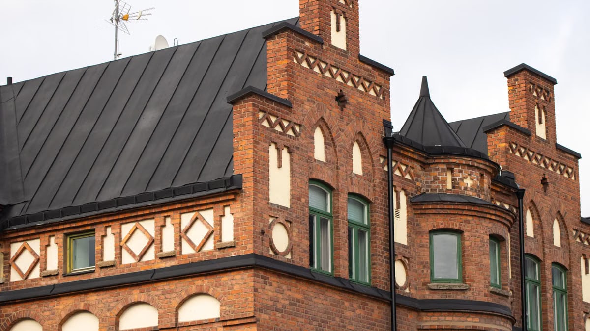 Close-up of a historic brick building featuring unique architectural elements.